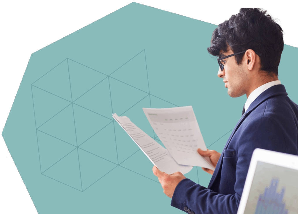 An image of a man analyzing a report.