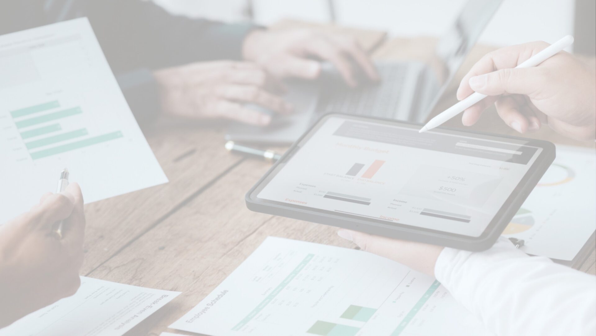 An image of people looking at analytic dashboards and reports.