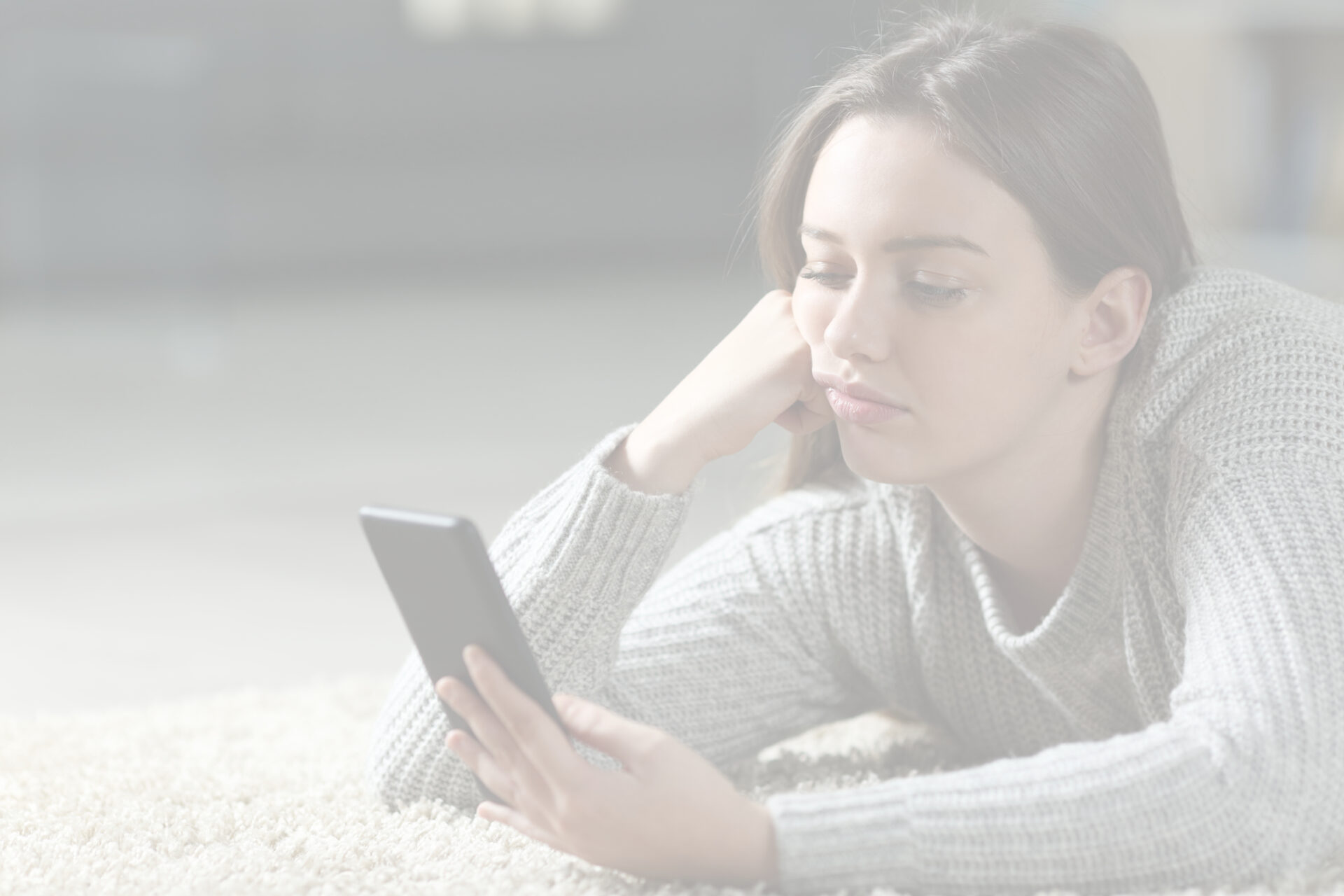 An image of a person with ADHD getting distracted by their phone.