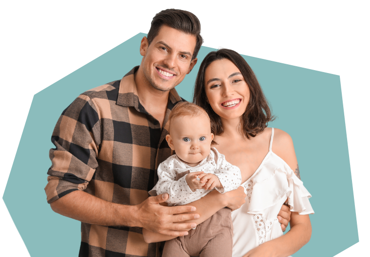 An image of two smiling parents holding a baby.