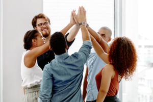 Coworkers giving each other a high-five.