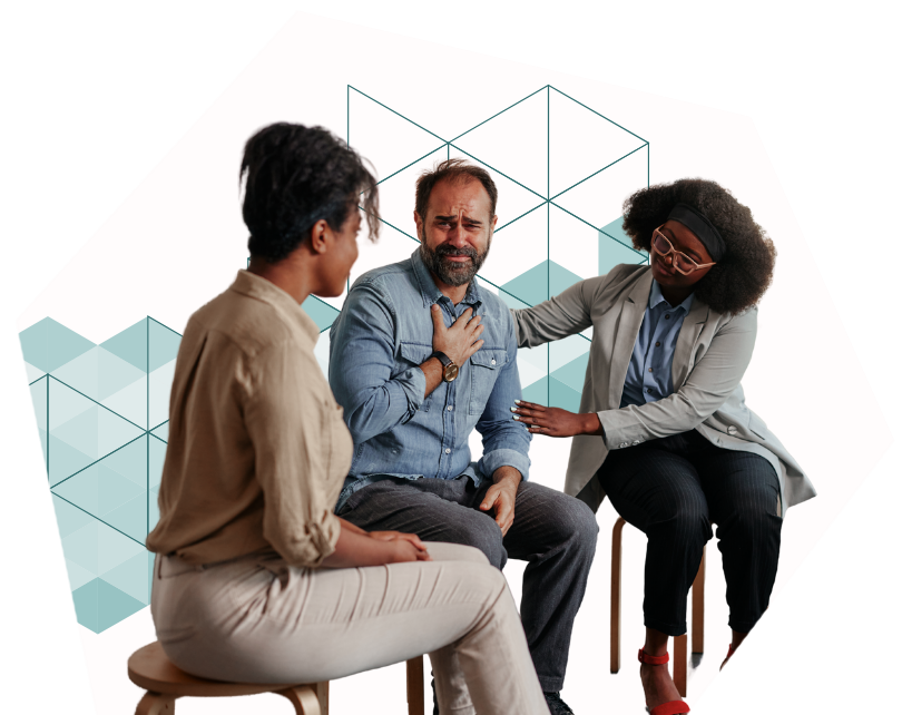 An image of a group of people comforting and providing emotional support to each other.