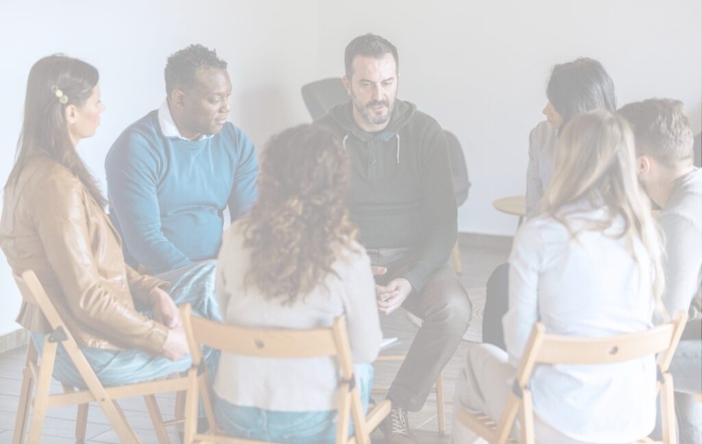 An image of a group of employees comforting each other.