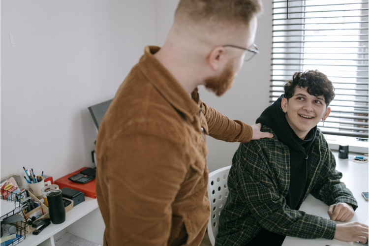 Organizational leader having a caring conversation with an employee.